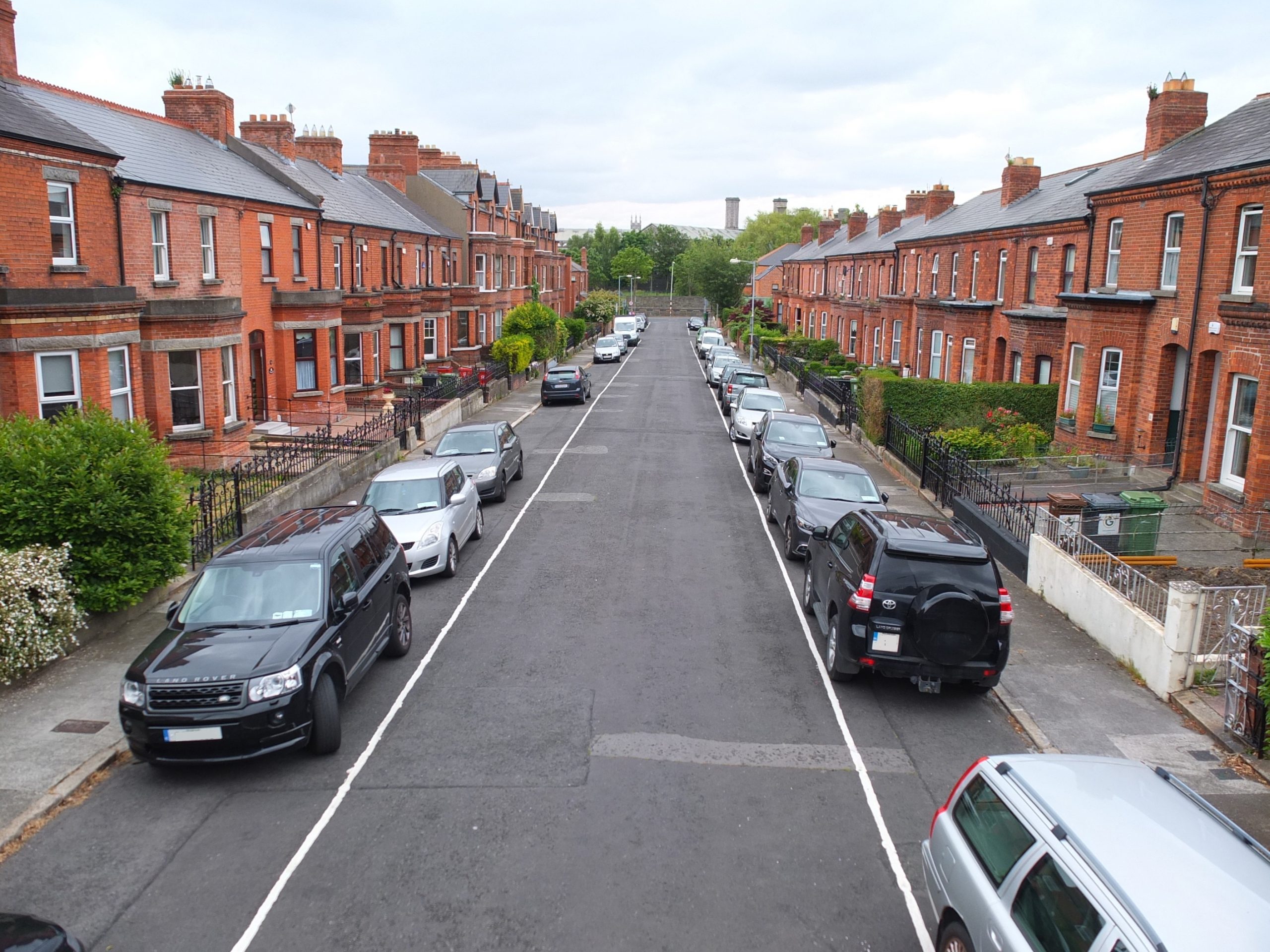 Expert Removals Cars parked on a street.