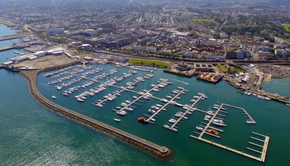 Expert Removals An aerial view of a marina with boats docked in it.