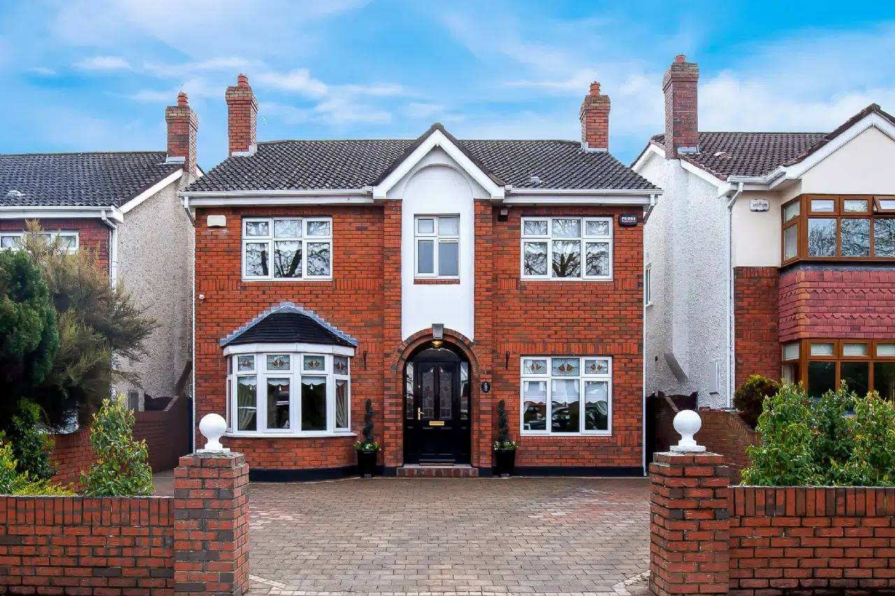 Expert Removals A red brick house with a brick driveway.