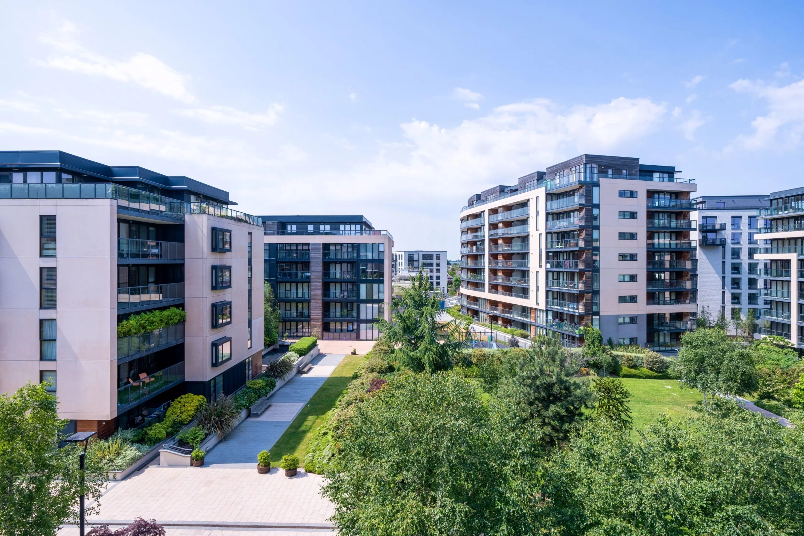 Expert Removals An aerial view of apartment buildings in a park.