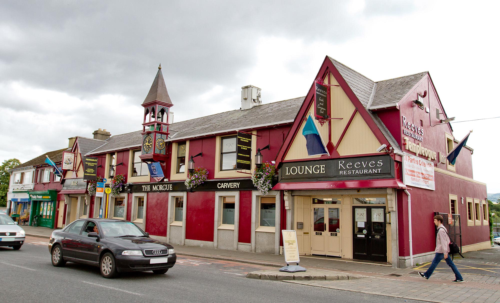 Expert Removals A red building with a clock tower.